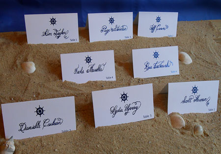 Calligraphy Escort Cards with Flourishes from Designs By Lorise